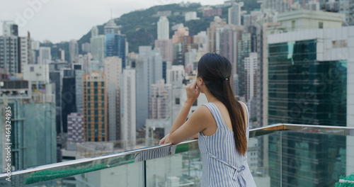 Woman look at the city of Hong Kong