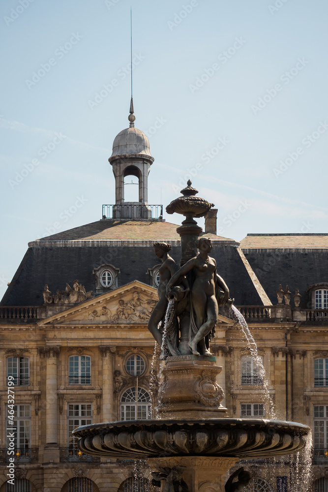 Statues of the fountain and facade of the stock exchange in Bordeaux, France