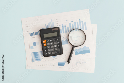 Obraz na płótnie Business graphs, charts, magnifying glass and calculator on table. Financial development, Banking Account, Statistics w salonie