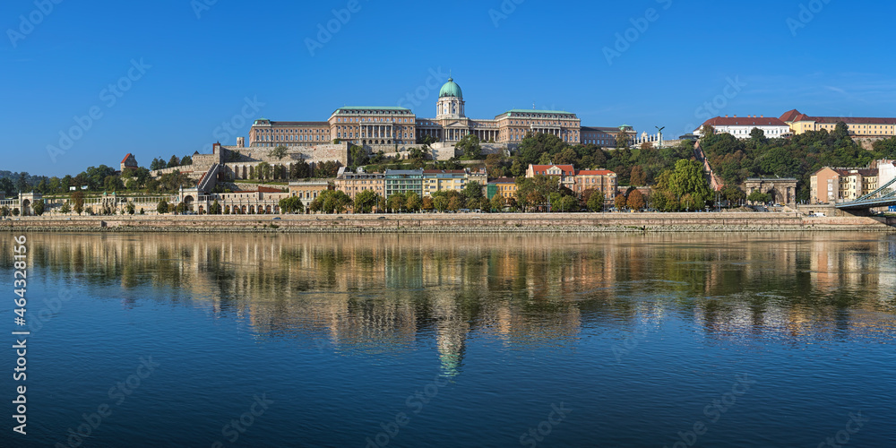Budapest, Hungary. Panoramic view of Castle Hill with Royal Palace, Castle Garden, Sandor Palace and Castle Hill Funicular. View from Danube in sunny autumn morning.