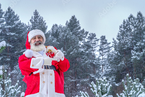 Santa Claus on Xmas Eve in the snowy forest