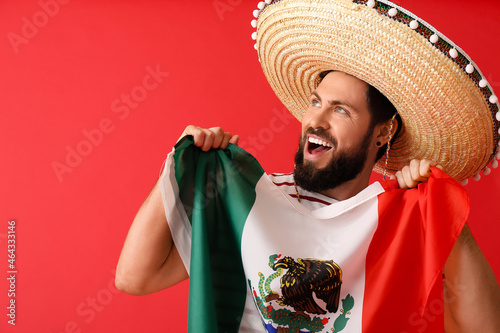 Handsome man in sombrero an...