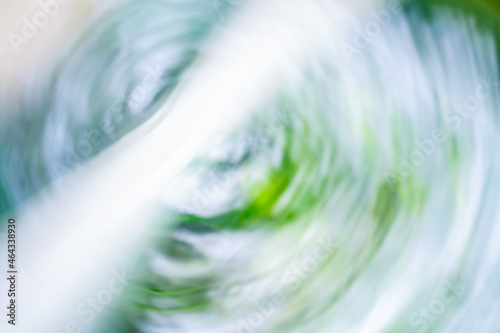 Fresh abstract background in shades of blue and green with highlights and swirls