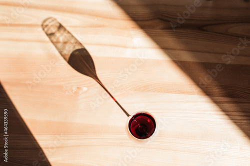 the shadow of a glass of wine