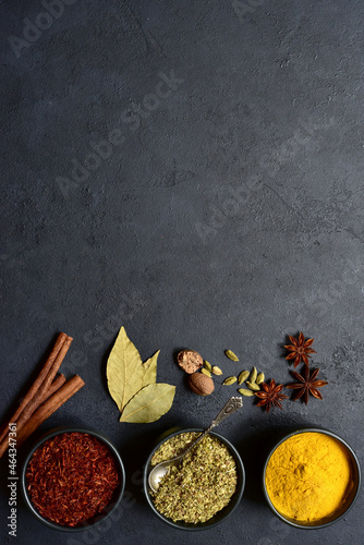 Set of spices : turmeric, saffron , dried thyme, cinnamon, nutmeg, anise. Top view with copy space.