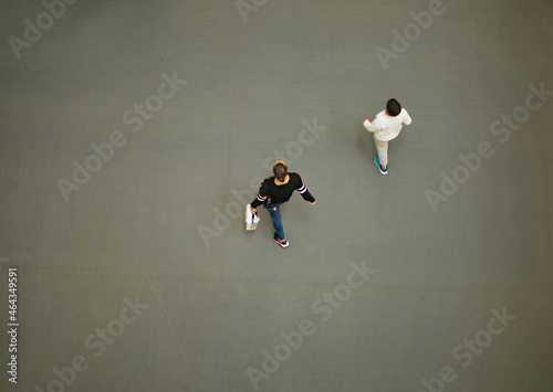 Принти на полотні two people shopping walking through a mall overhead view