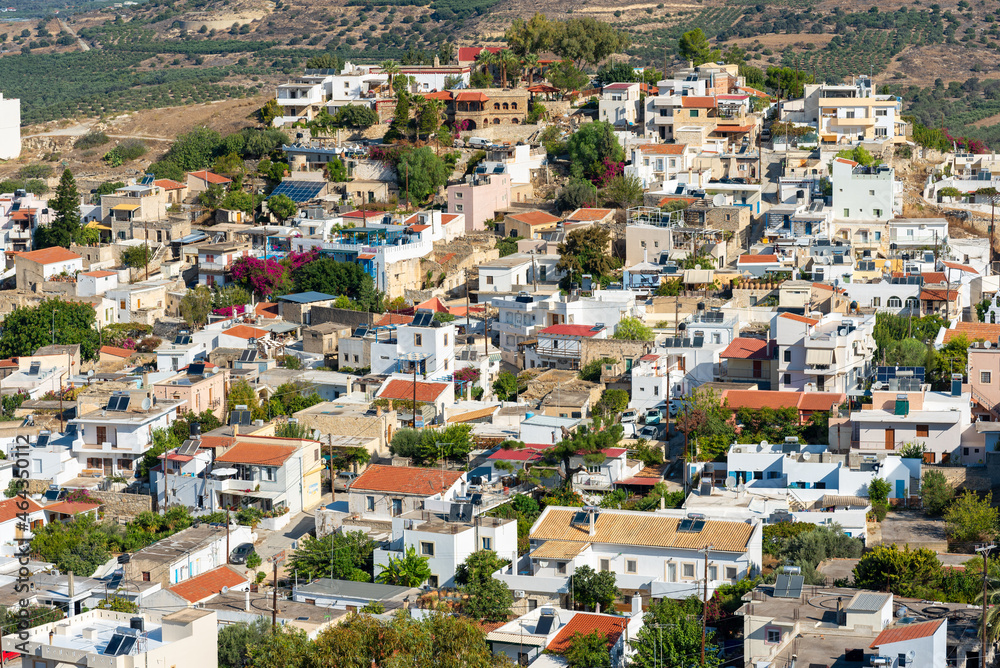 View down to the picturesque village Kamilari. Located in the south of Crete, near Phaistos and the mediterranean sea, the village is a popular tourist destination