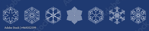 white snowflakes on dark blue background.