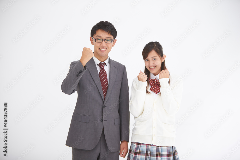 ガッツポーズの男性教師と女子高生 ガッツポーズの男性教師と女子高生