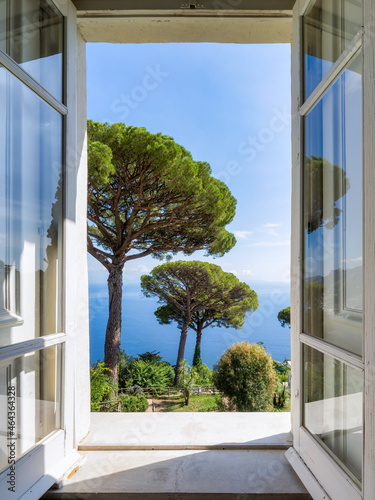 Window view of a garden with pine trees at Villa Rufolo, Ravello, Capri, Italy photo