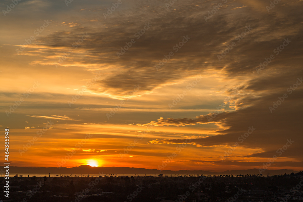 Dramatic Cloudy Orange Sunset over the Channel Islands as Seen from Newport Beach Back Bay 