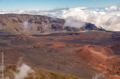 Peeking Over the Rim Into the Haleakala Volcanic Crater National Park in Maui Hawaii From On Board A Helicopter Aerial Tour
