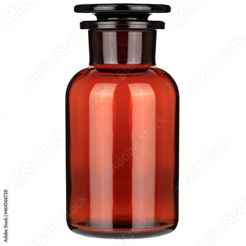 Closed clasisc medical bottle of amber color glass. Glass jars with chemicals. Closed amber bottle.