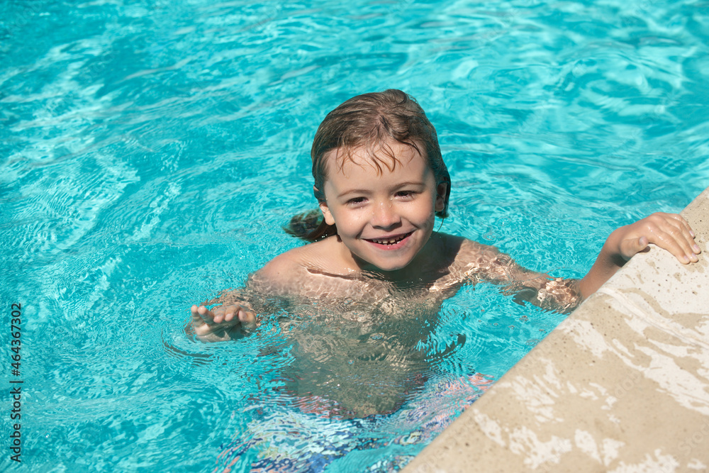 Boy Practice Swimming. Cute child boy swim in swimming pool, summer water background with copy space. Funny kids face.
