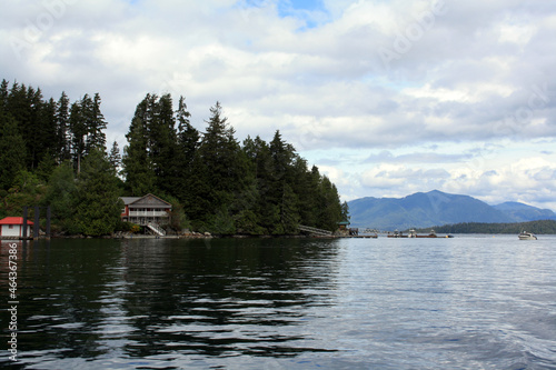 Beautiful view of a calm lake with mountains in the background in Bamfield, British Columbia, Canada photo