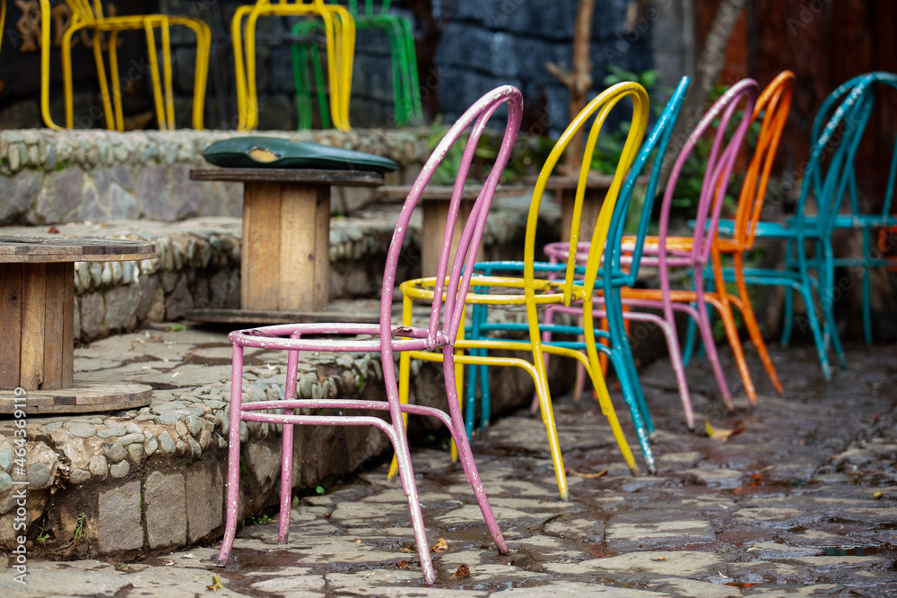 Group of colorful painted chairs at the small town of Salento in Colombia