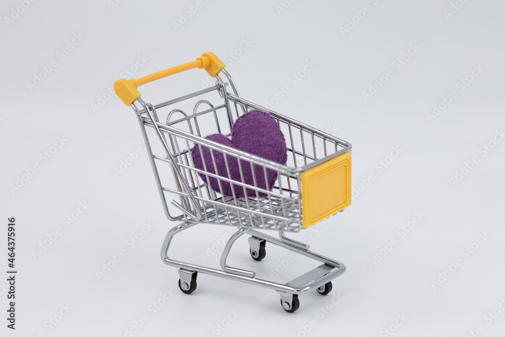 Model metal shopping cart, purple sponge heart inside