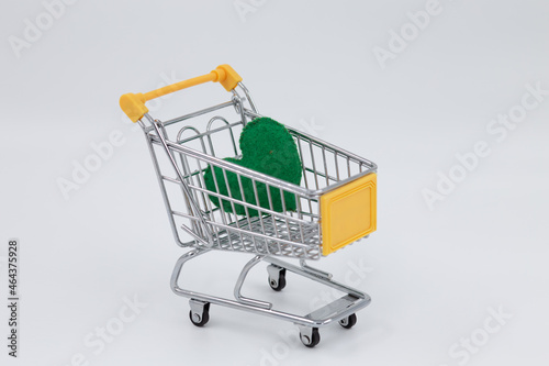 Model metal shopping cart, green sponge heart inside