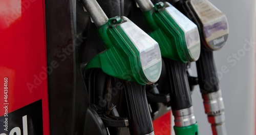 Row of three fuel pumps in stand at petrol station photo