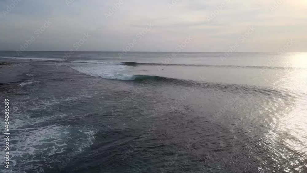 Surfers sitting on the surfboards and waiting for a wave. Surfers sitting on the surfboards and waiting for a wave.