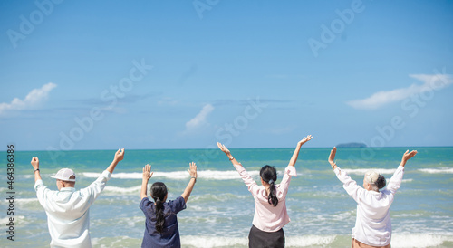 Happy family having fun on the beach. asian people senior couple happy and relax on the beach. Family vacation holiday