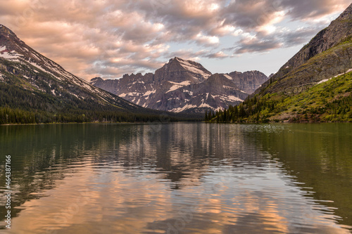 Mount Gould at Lake Josephine - A colorful Spring sunset view of Mount Gould towering at shore of Lake Josephine. Many Glacier, Glacier National Park, Montana, USA. photo