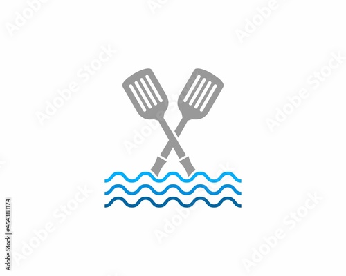 Spatula crossed on the sea wave illustration logo