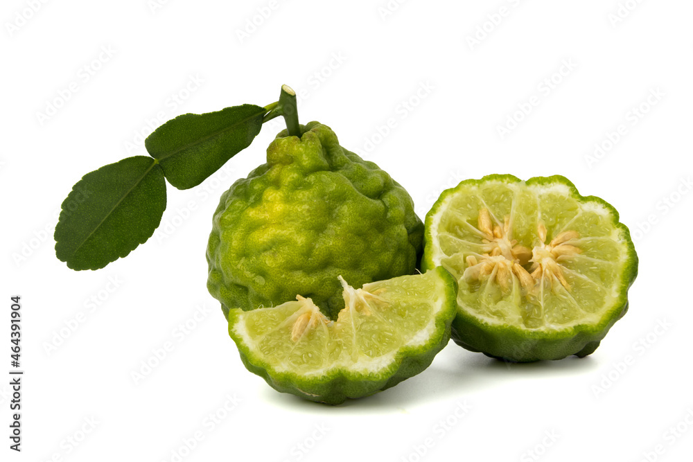 Fototapeta premium Bergamot fruit slices, fresh Bergamot fruit leaves isolated on a white background