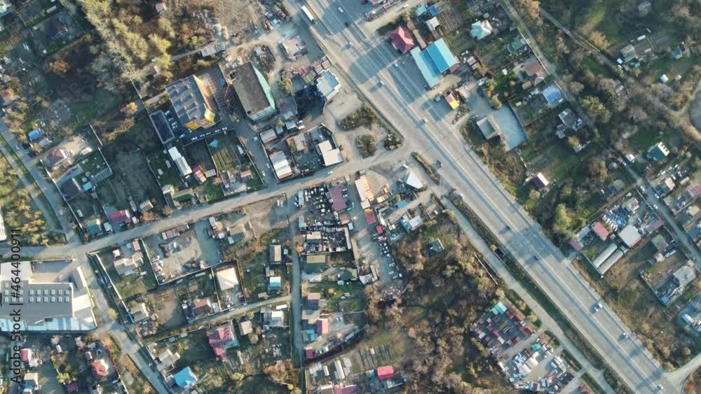 aerial view, two-lane highway with cars moving along it during the day aerial view, two-lane highway with cars moving along it during the day