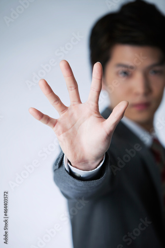 手で制止するビジネスマン photo