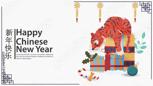 The symbol of the Chinese new year is a little tiger cub lying on gift boxes and looking at a candy the inscription congratulations vector flat