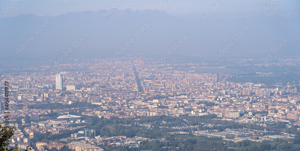 Torino, Italy. Amazing view of the city from the Superga hill. Morning panorama. Haze and pollution covering the city