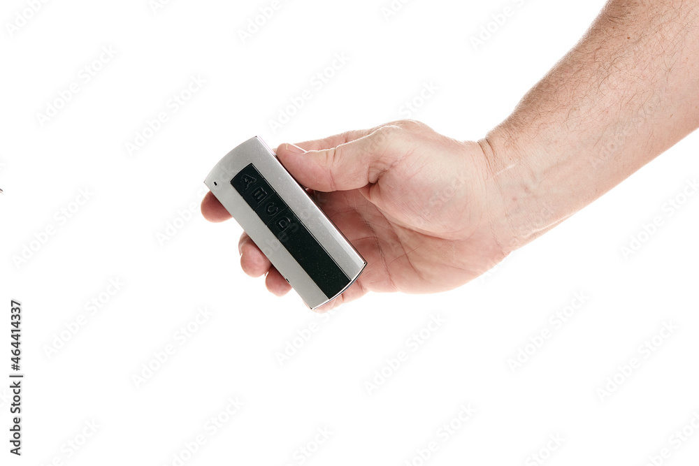 Hand holds a remote control on a white background, template for designers. Hand holds a remote control on a white background, template for designers.