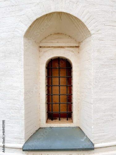 Antique window with metal bars © kos1976