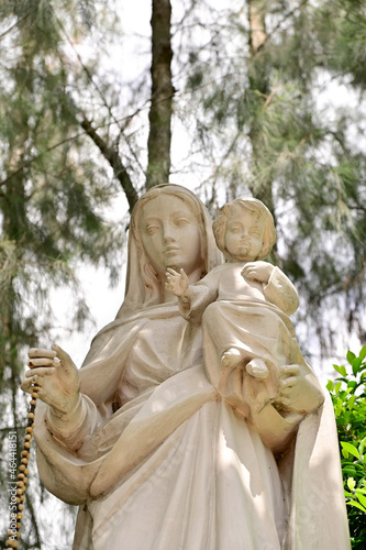 Statue of Our lady and child Jesus catholic church with natural background. at thailand