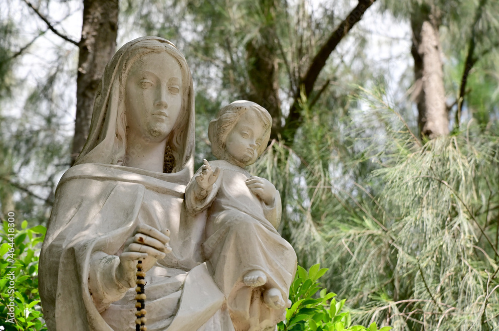 Statue of Our lady and child Jesus catholic church with natural background. at thailand Statue of Our lady and child Jesus catholic church with natural background. at thailand