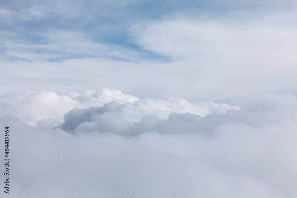 Naklejka premium Flying in the white clouds . Cloudscape view
