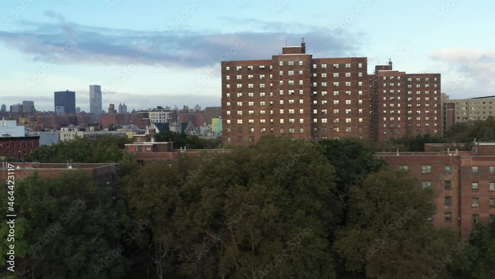 fast aerial trucking shot alongside housing project in New York City's Harlem neighborhood fast aerial trucking shot alongside housing project in New York City's Harlem neighborhood