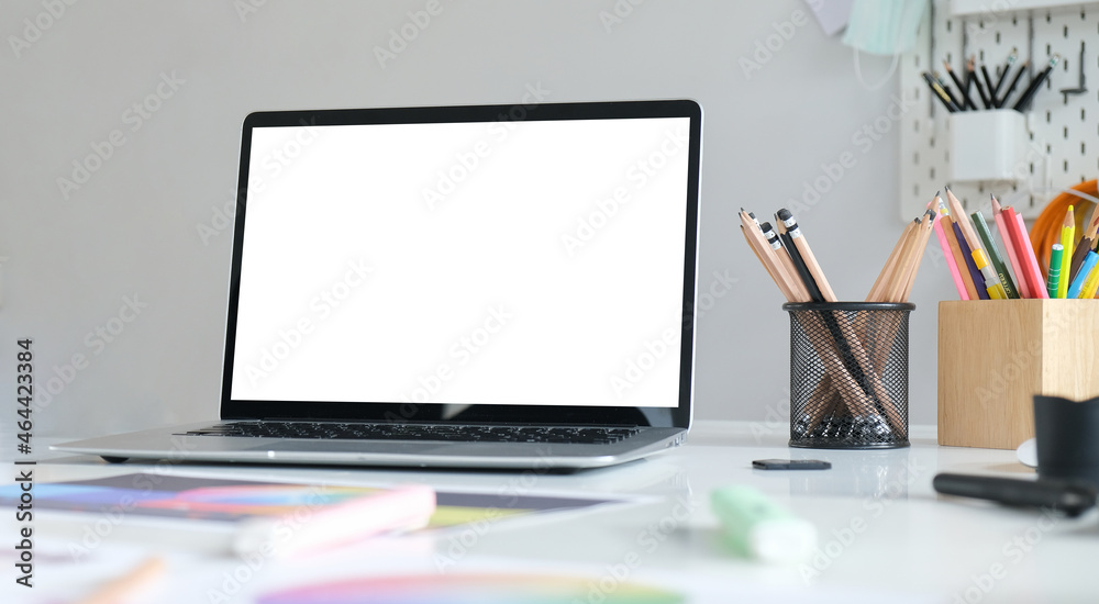 Creative workspace with blank screen on white table.. Creative workspace with blank screen on white table..