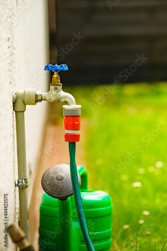 Garden tap with hosepipe attached.