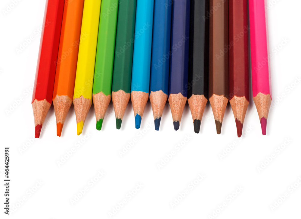 a set of colored pencils lies in a row on a white background with a copy of the space a set of colored pencils lies in a row on a white background with a copy of the space