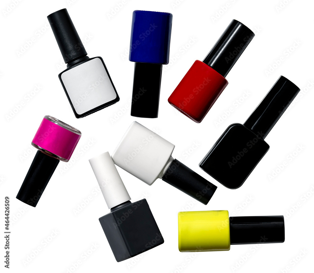 Various in color and shape bottles of gel nail polishes isolated on a white background. Blank for the design of advertising and printed products for manicure salons. Various in color and shape bottles of gel nail polishes isolated on a white background. Blank for the design of advertising and printed products for manicure salons.