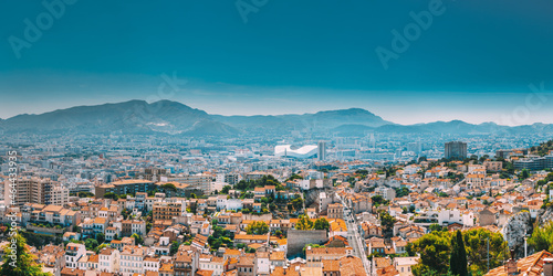 Urban panorama, aerial view, cityscape of Marseille, France. Sunny summer day with bright blue sky. Cityscape of Marseille, France. Urban background with sport Velodrome stadium. Stade Velodrome photo