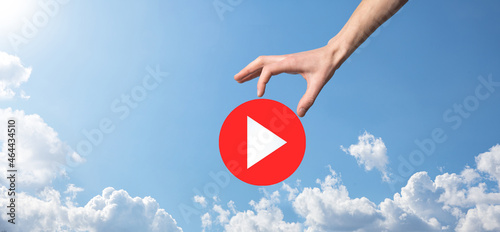 Businessman pressing, hold play button sign to start or initiate projects.Video Play Presentation. Idea for business, technology.media player button. Play icon.Go.