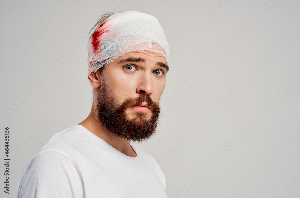 bearded man head and arm injuries health problems isolated background