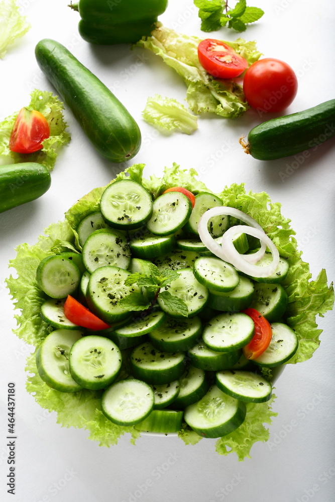 Bowl of fresh cucumber salad with herbs and oil Bowl of fresh cucumber salad with herbs and oil