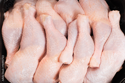 Fresh chicken leg with skin many pieces close-up for a supermarket, retail. Raw chicken meat.Raw chicken legs .