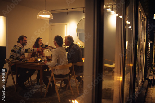 Christmas dinner in warm and cozy scandinavian home photo