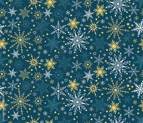 Winter pattern seamless background with snowflakes. Silver gold and neavy christmas motif