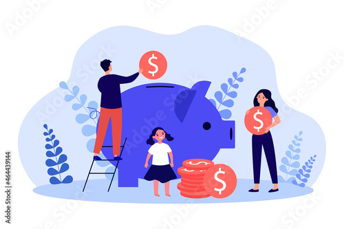 Foto Family putting money coins in piggy bank
